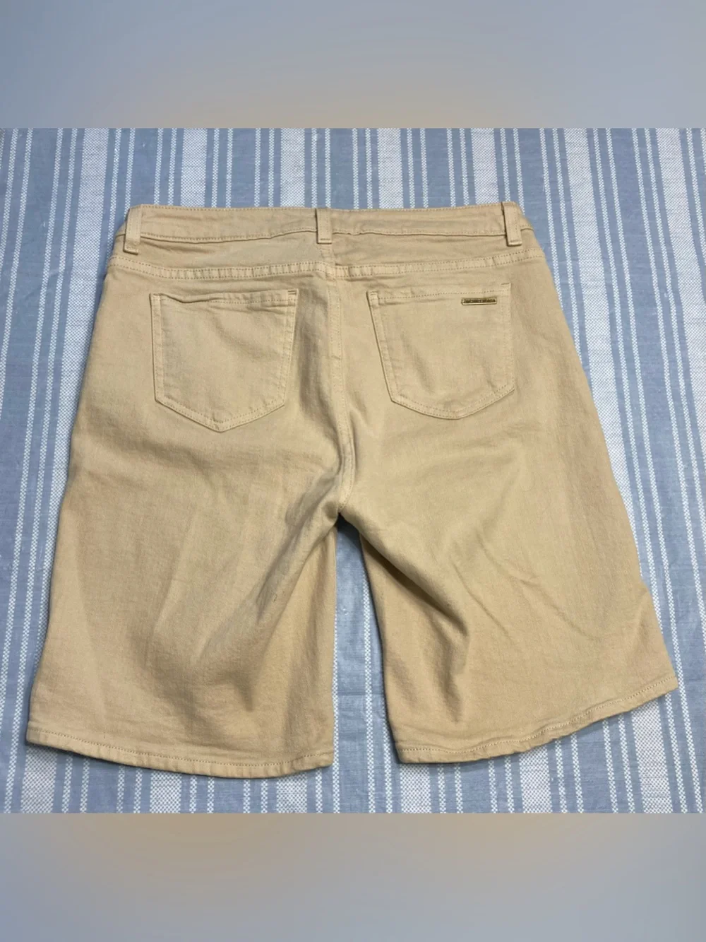 Michael Kors tan Bermuda shorts.